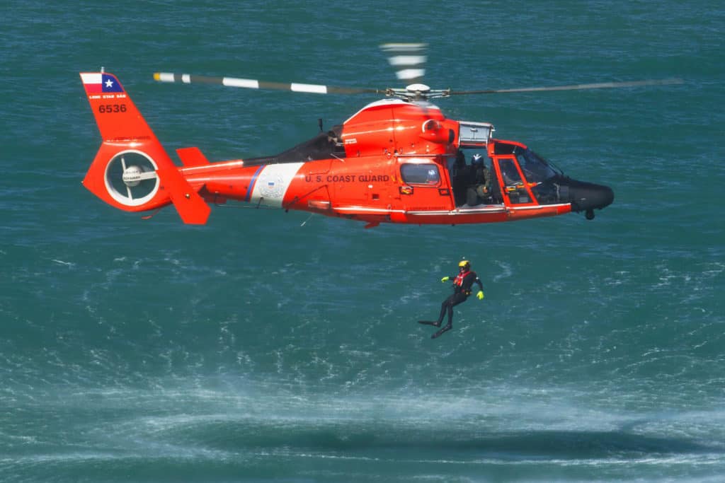 US Coast Guard diver with helicopter