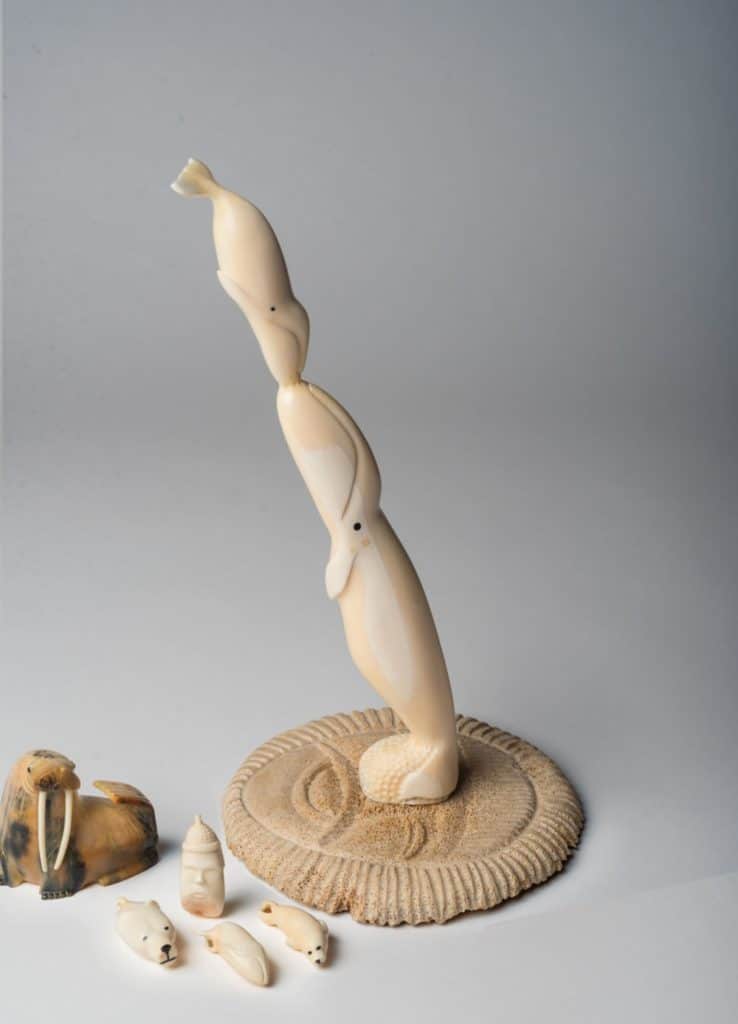 native tribal art of whales carved from ivory