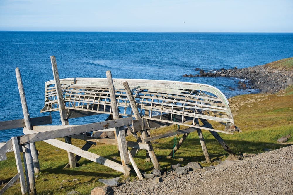A boat frame near the ocean shore