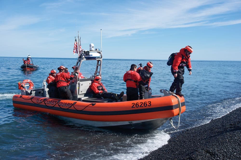 U.S. Coast Guard on the shore of an beach