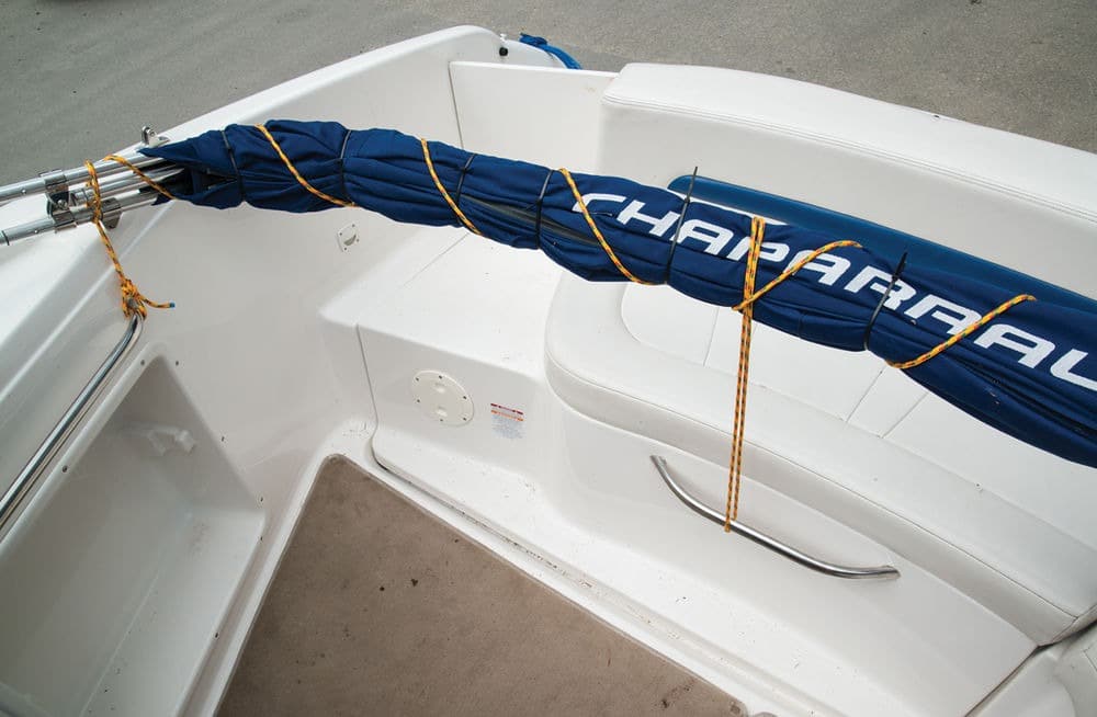 A secured top and enclosure on a sport-fishing boat