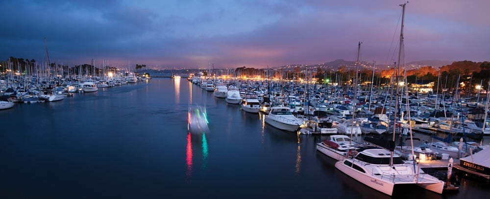 A boat marina at night