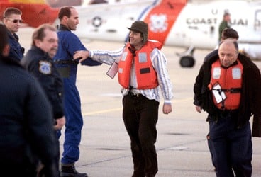 People standing around a rescue helicopter