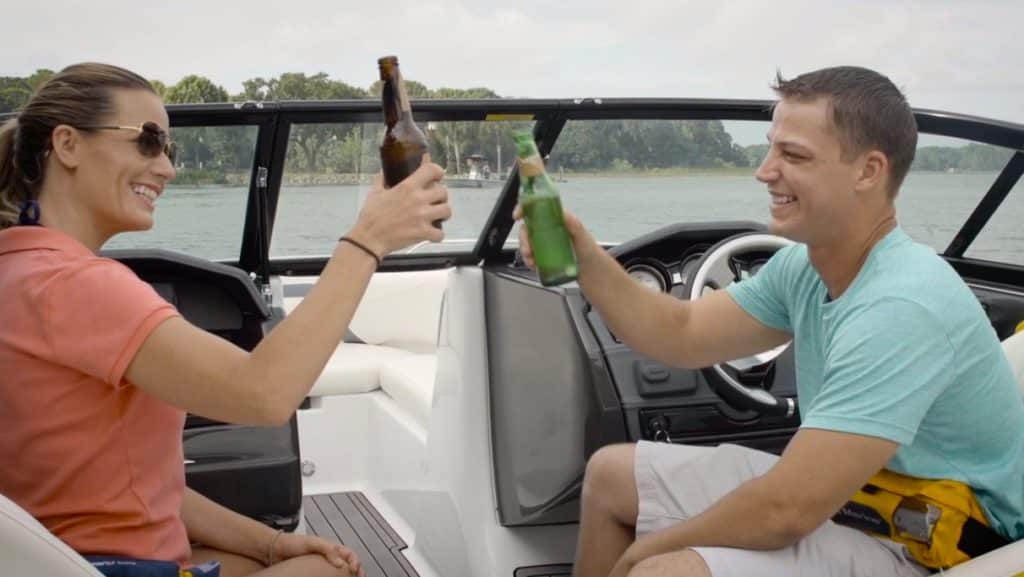 People drinking alcohol on a boat.