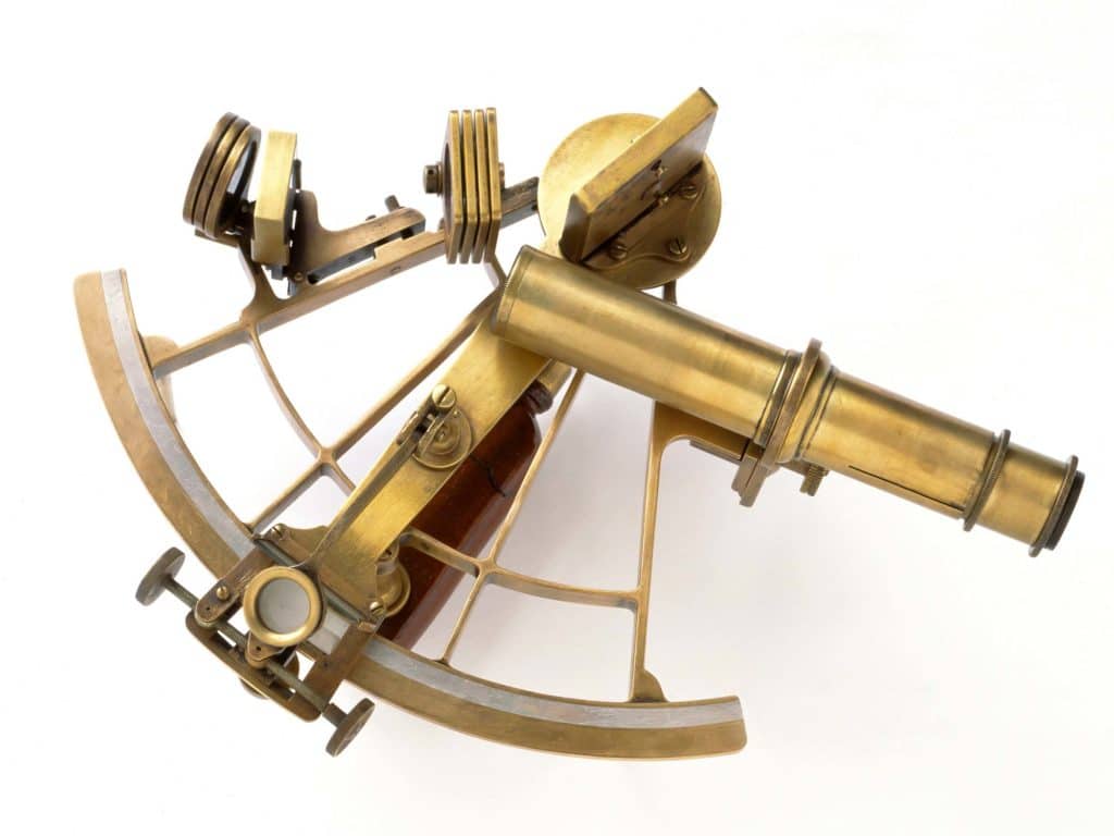 Brass Sextant on white.