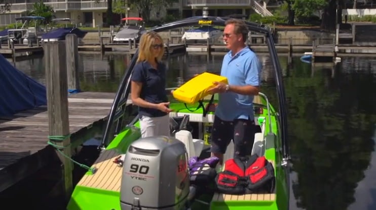 two people standing on a boat