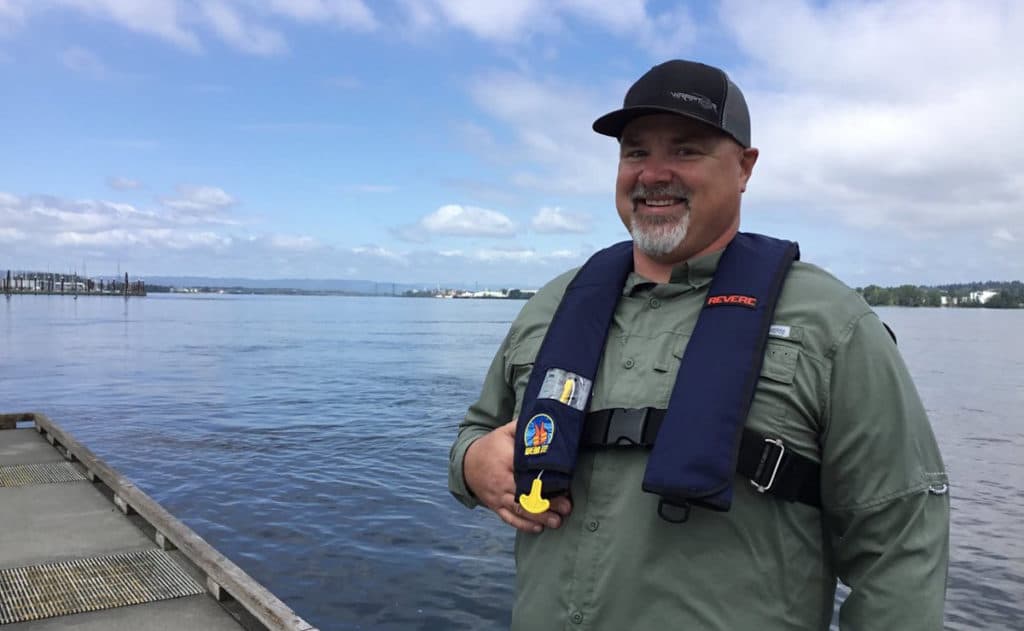 Chris McMahon wearing a life jacket