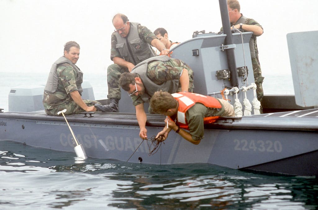 Coast Guard members wearing life jackets