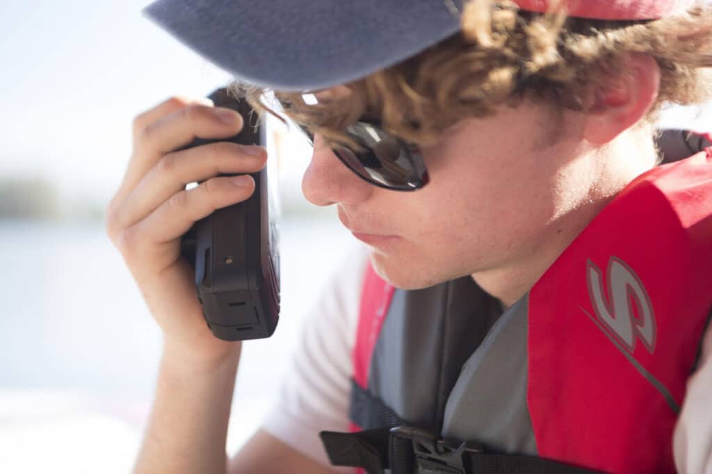 Speaking into a VHF radio.